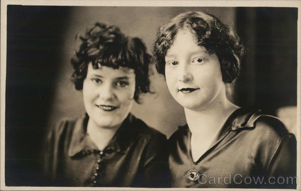 Two Young Women Wearing Dark-Colored Blouses House of David
