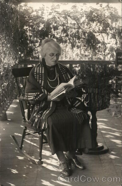 White-Haired Woman in Rocking Chair Reading Book Benton Harbor Michigan
