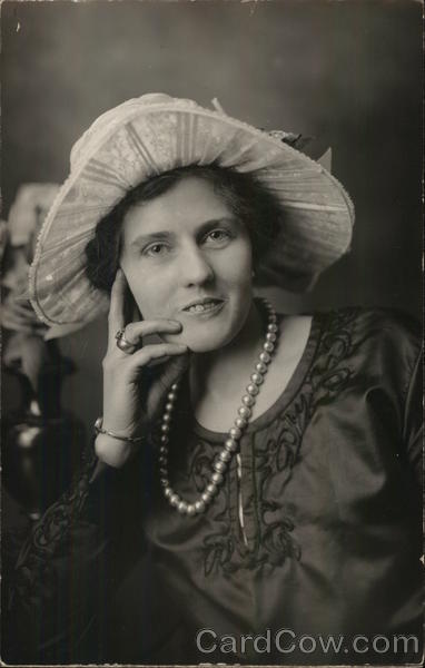 A Woman Wearing a Hat and Pearls House of David