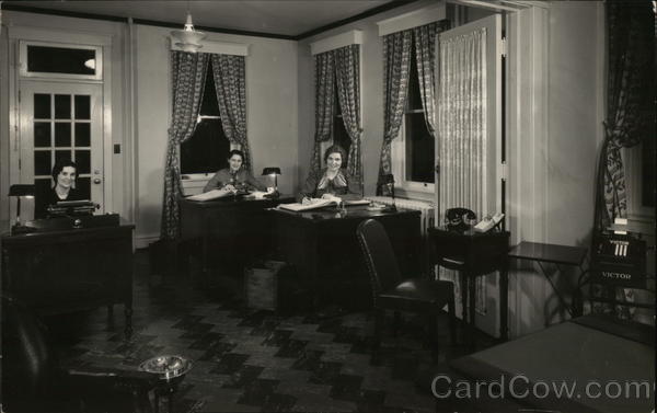 Three People Seated at Three Desks in Office Setting Benton Harbor Michigan