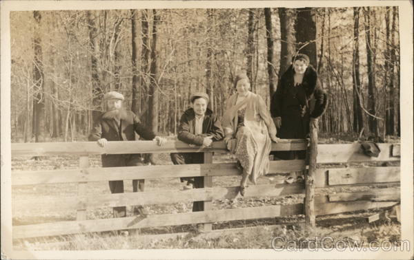 Four People Leaning and Sitting on a Fence Benton Harbor Michigan
