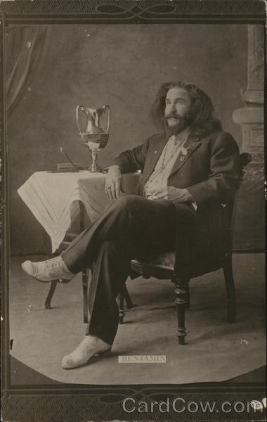 A Man Sitting Next to a Table House of David