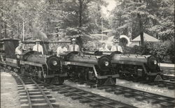 Six Men Riding Small Trains Postcard