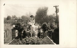 A Woman Sitting in Garden Postcard