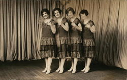 Four Women in Matching Dresses Near Curtain on Stage Postcard