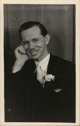 Man in Dark Suit Smiling - Emerald Woodworth Postcard