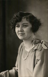 Young Woman with Short Dark Hair and Pearl Strand Postcard