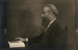 A Man Reading a Book Postcard