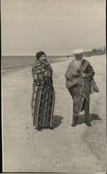 Man and Woman on Beach Wearing Blankets Postcard