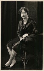 Woman with Long Braid Seated Postcard