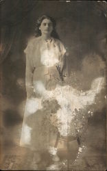 A Woman Standing Next to a Table Postcard