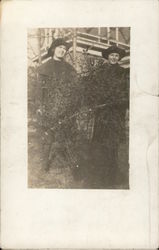 Two Women Wearing Coats and Hats Outdoors Postcard