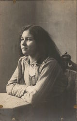 Dark-Haired Woman Seated at Table - Mabel James Sept. 1913 Postcard