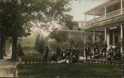 A Group of Men with Instruments (Tinted Color Real Photo) Postcard