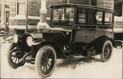 Dark, Shiny Automobile Parked in Snow Postcard