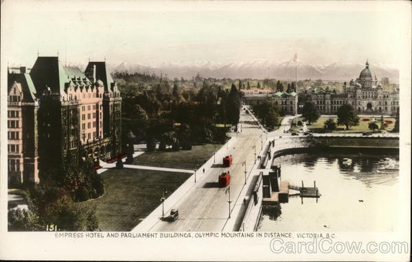 Empress Hotel and Parliament Buildings, Olympic Mountains in Distance Victoria BC Canada
