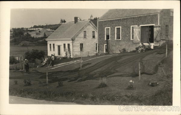 Men Mend Nets Near Buildings Monhegan Maine