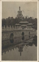 Exotic Structures Near Bridge Crossing Water Postcard