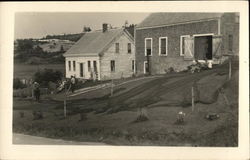 Men Mend Nets Near Buildings Postcard