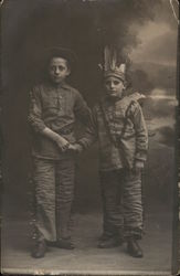 Two Boys in Costumes Shaking Hands Two Boys in Costumes Shaking Hands