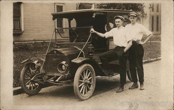 Two Men Posing Beside Studebaker Delivery Truck Cars