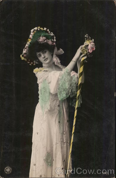 Woman Wearing Large Hat, Lacy Dress, Holding Tall Stick