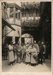 Unidentified Men and Women Before an Archway Postcard