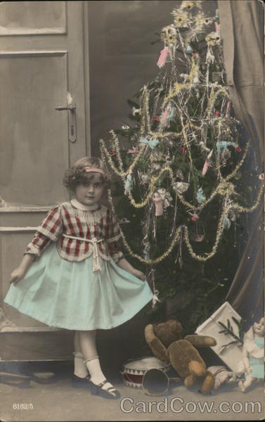 Little Girl in front of Christmas Tree Children