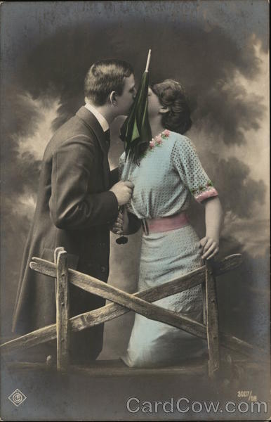 Couple Kissing with Umbrella Couples