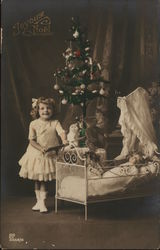 Pretty Girl with Doll in front of Christmas Tree Pretty Girl with Doll in front of Christmas Tree