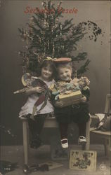 Children With Presents Under Christmas Tree Postcard