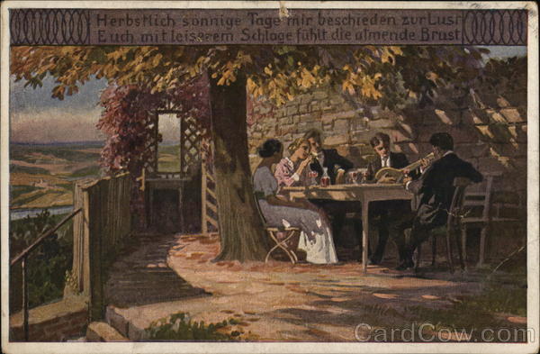 Men and Women Seated at Table, Dining Outdoors Near Tree