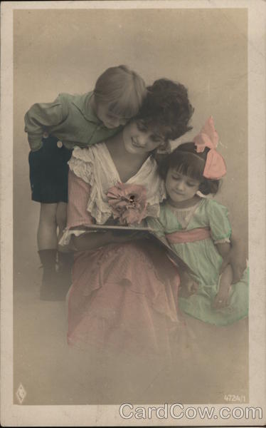 Woman reading a book with Children