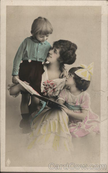 Woman with Two Children reading a Book