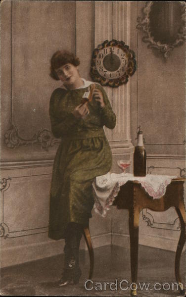 Woman Standing Next To Table With Champagne Bottle
