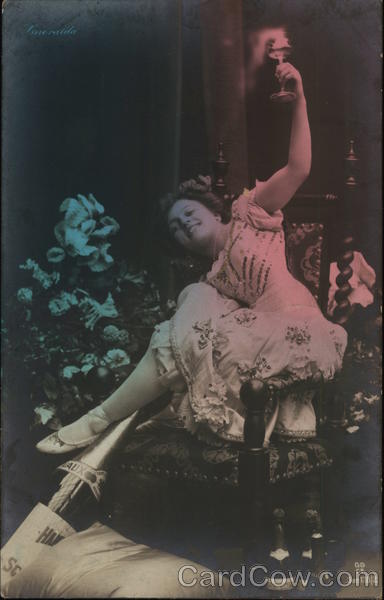 Smiling Woman Holding Stemmed Glass in Air Near Flowers