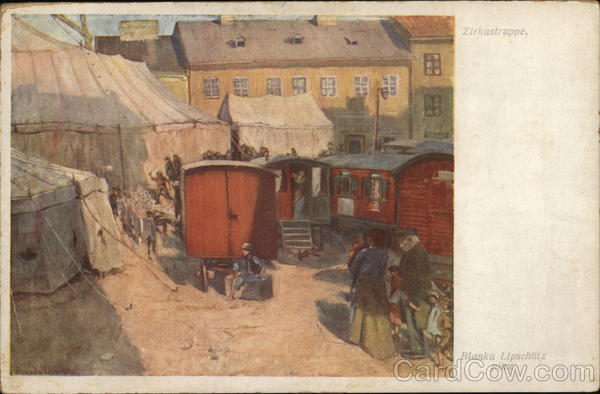 Circus Wagons and People Near Large Tents and Buildings