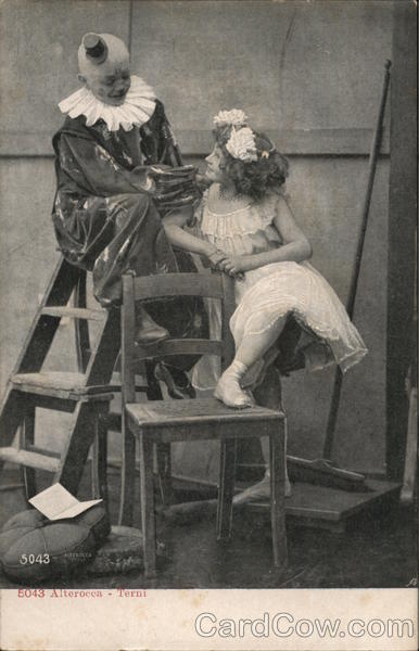 Clown Seated Atop Ladder Near Young Woman and Chair
