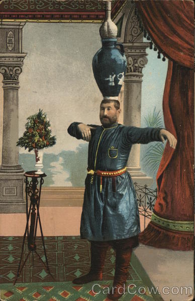 Man in Blue Tunic Balancing Vases on Head Men