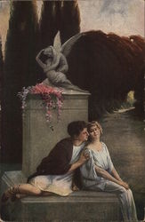Man and Woman Sitting Close Together Near Statue and Flowers Man and Woman Sitting Close Together Near Statue and Flowers