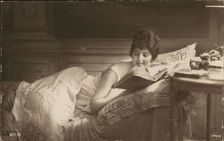 Woman Laying on Bed Reading Book Woman Laying on Bed Reading Book