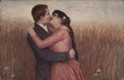 Man and Woman Kissing, Embracing in Field Man and Woman Kissing, Embracing in Field
