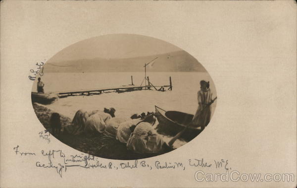 Women Digging in shore of lake