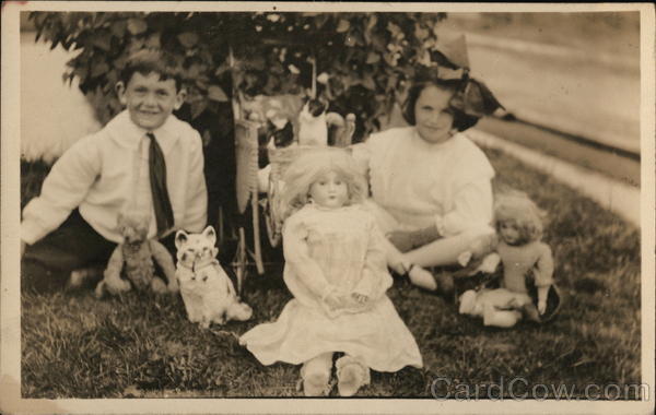 Children Posing With Toys Dolls