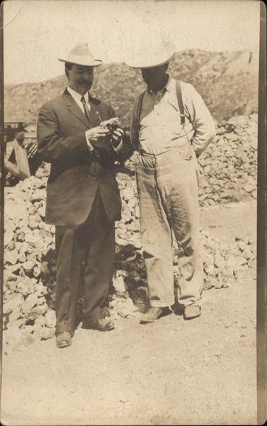 Examining Rock at Mexican Mine Mexico