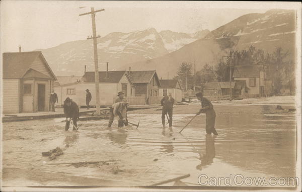 Men Clearing Flooded Street - Valdez? Alaska