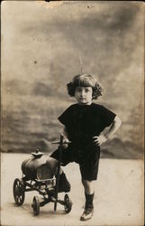 Portrait of Child With Toy Cart Portrait of Child With Toy Cart