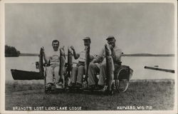 Fishermen in Wheelchairs with Catch at Brandt's Lost Land Lake Lodge Hayward, WI Postcard Postcard Postcard