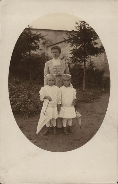 A Woman With Two Small Girls Children