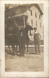 Man Holding Two Horses Man Holding Two Horses